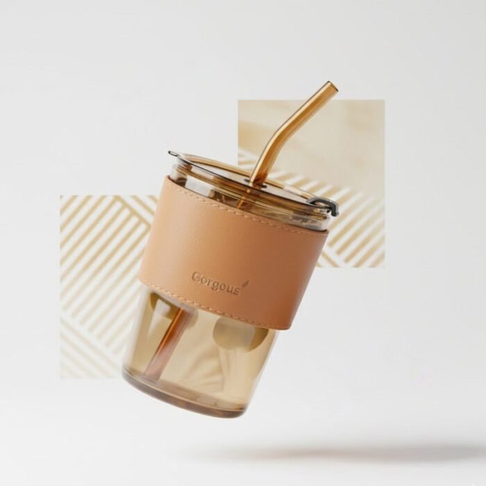 Aesthetic glass coffee tumbler with leather sleeve and straw