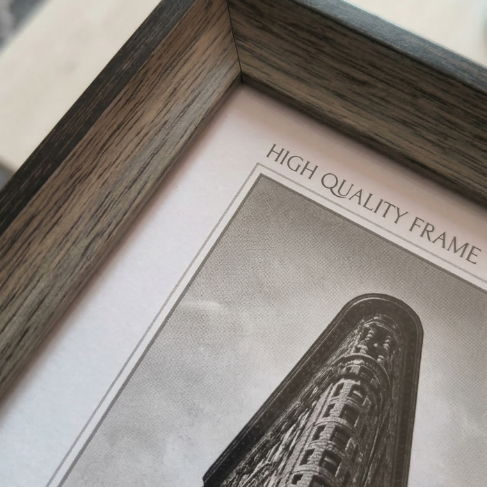 Framed minimalist black and white artwork of a dramatic flatiron-style building perspective for home decor