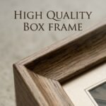 Black and white vintage European building facade wall art in a wooden frame